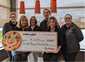 Attending the Spring 2024 Smile Cookie Campaign cheque presentation, (l-r) front row, seated: Margret Norenberg, Chair, KDH Foundation Board and Ingrid Kohling, Tim Horton’s franchise owner, Kemptville Mall. Standing, (l-r) Tonya Dunty, Tim Horton’s Manager, Joanne Mavis, CEO, KDH Foundation, Jose Salvador, Tim Horton’s franchise owner, Colonnade Mall and Katrina Wallace, Tim Horton’s Manager.