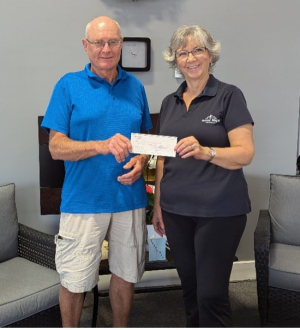 Willy Meerakken, representing the Kemptville Ole Timers Hockey Club, presented a cheque to KDH Foundation Board Director, Deb Girard, for the CT Scanner Campaign